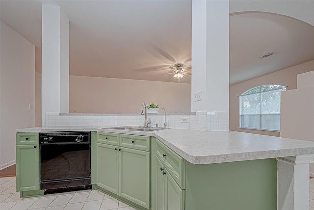 kitchen featuring ceiling fan, sink, black dishwasher, kitchen peninsula, and green cabinetry