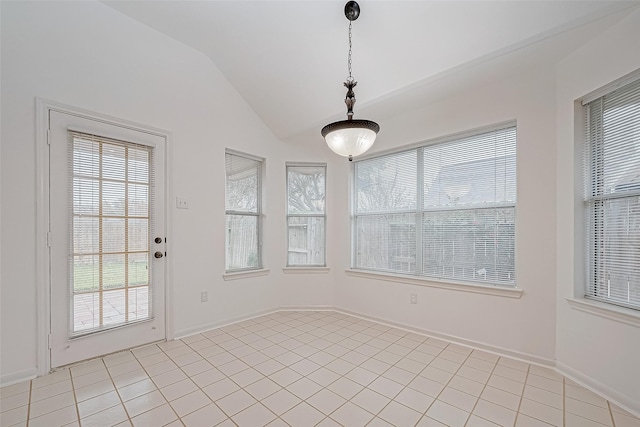 interior space featuring light tile patterned floors and vaulted ceiling