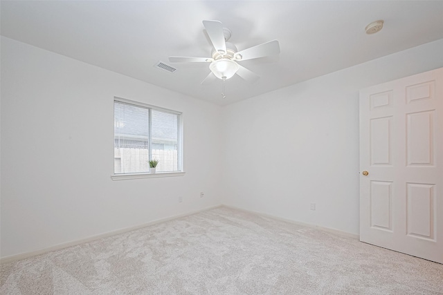 carpeted empty room with ceiling fan