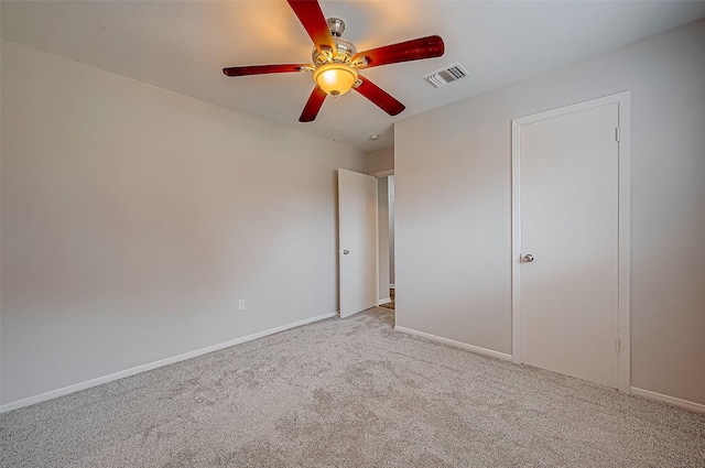 unfurnished bedroom with light carpet and ceiling fan