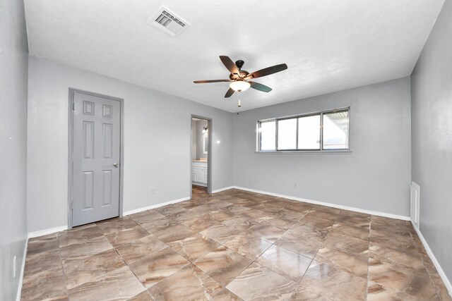 spare room with ceiling fan