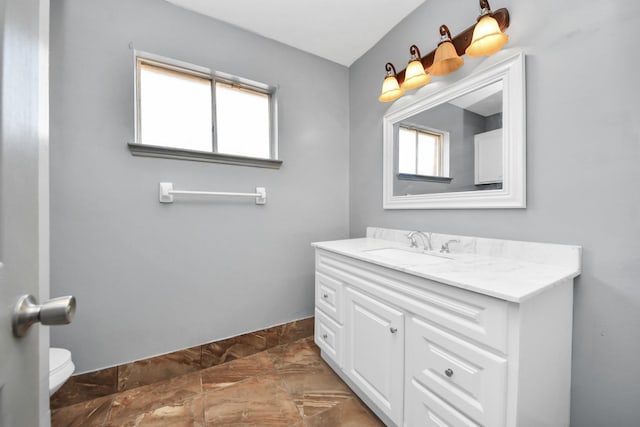 bathroom with vanity and toilet