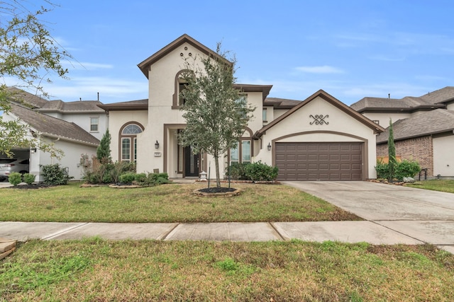 view of front of home featuring a garage and a front yard