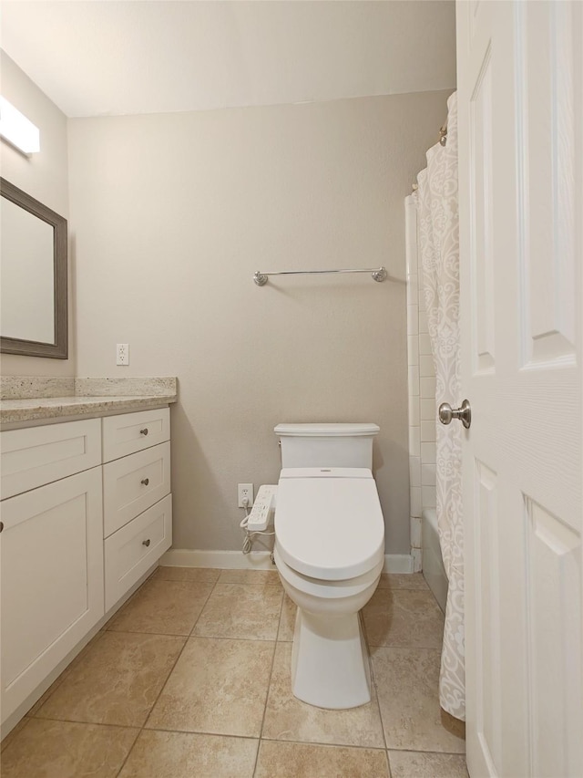 full bathroom with tile patterned floors, shower / bath combo with shower curtain, vanity, and toilet