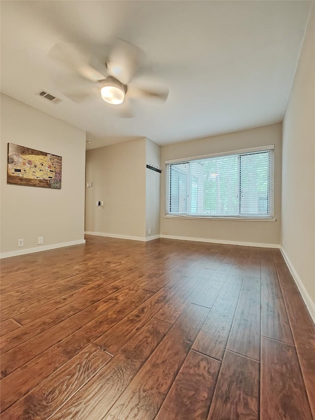 empty room with hardwood / wood-style flooring and ceiling fan