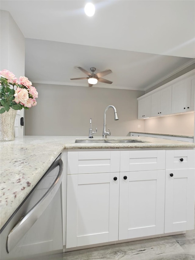 kitchen with white cabinetry, sink, stainless steel dishwasher, and ornamental molding