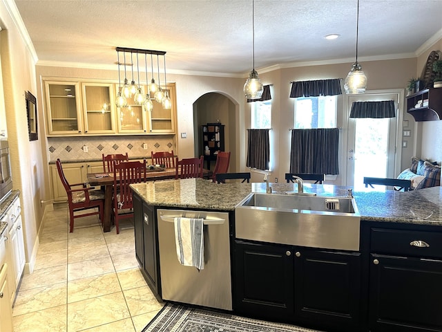 kitchen featuring decorative backsplash, ornamental molding, sink, pendant lighting, and dishwasher