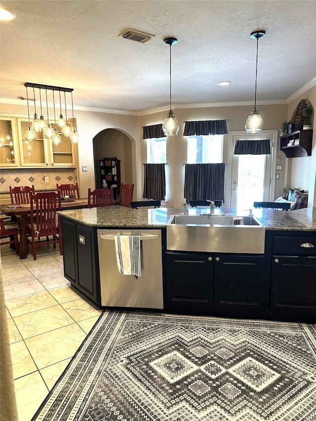 kitchen featuring dishwasher, crown molding, and hanging light fixtures