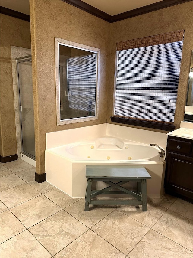 bathroom with tile patterned flooring, vanity, ornamental molding, and shower with separate bathtub