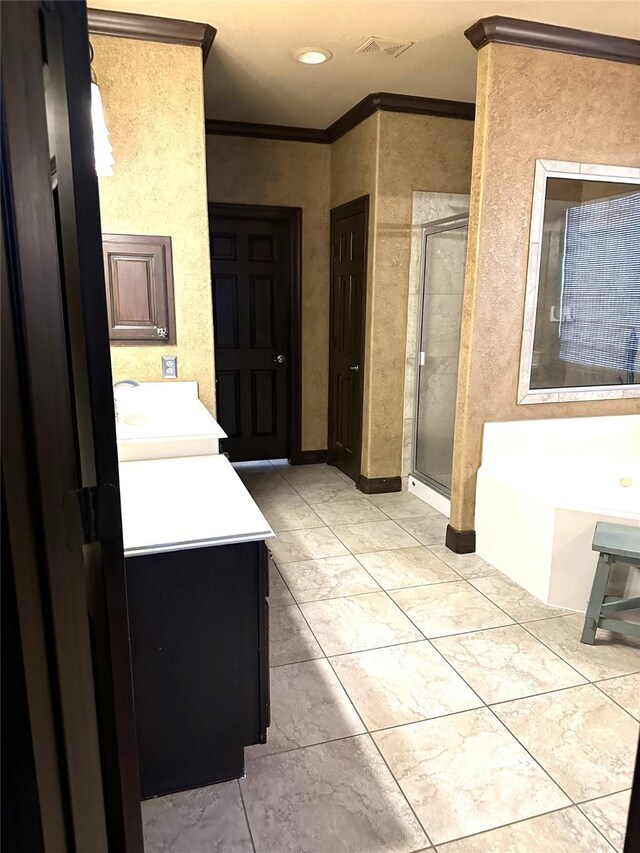 bathroom featuring vanity, independent shower and bath, and ornamental molding