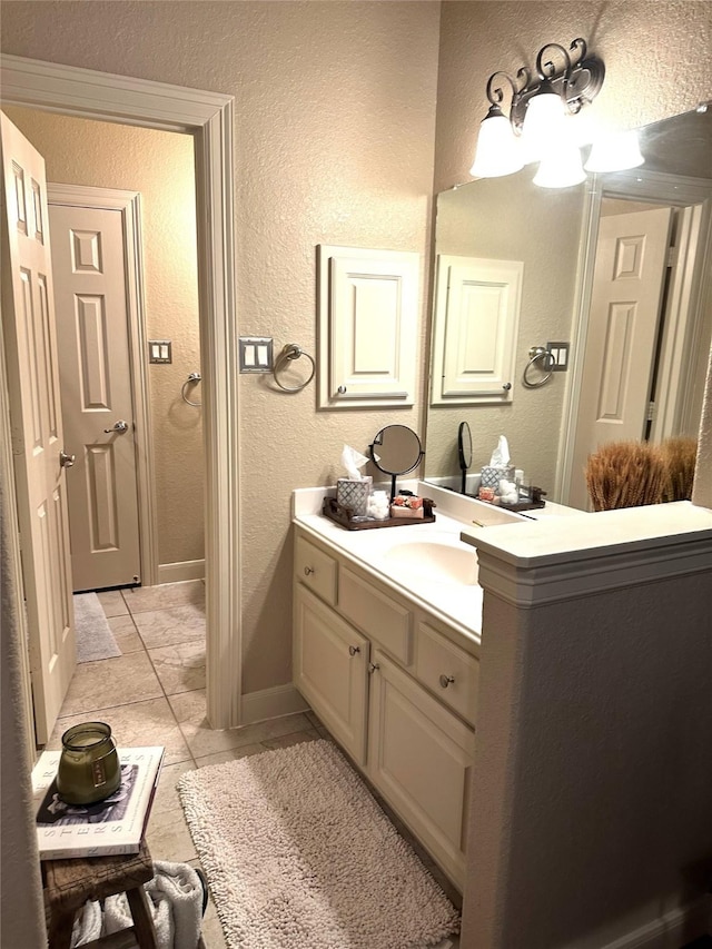 bathroom with tile patterned flooring and vanity