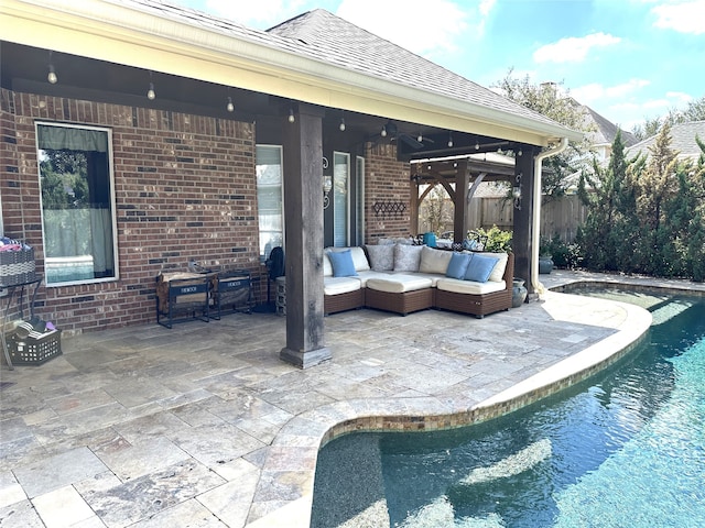 view of pool with an outdoor hangout area, ceiling fan, and a patio area