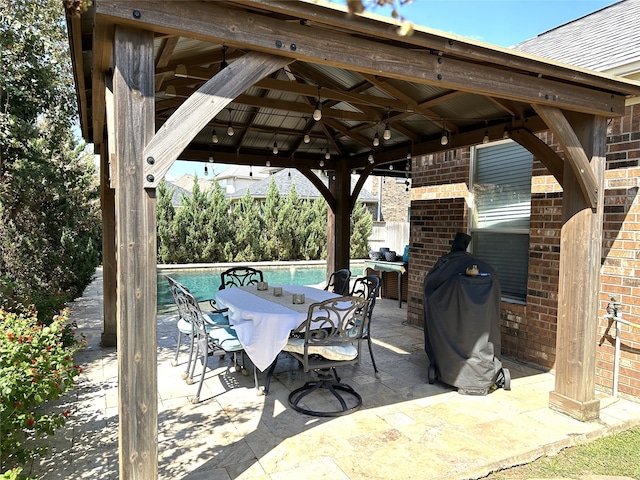 view of patio featuring a gazebo and a grill