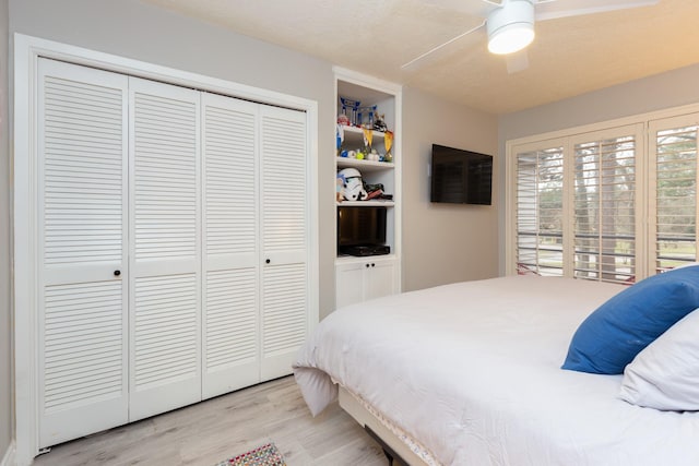 bedroom featuring a closet, ceiling fan, and light hardwood / wood-style floors