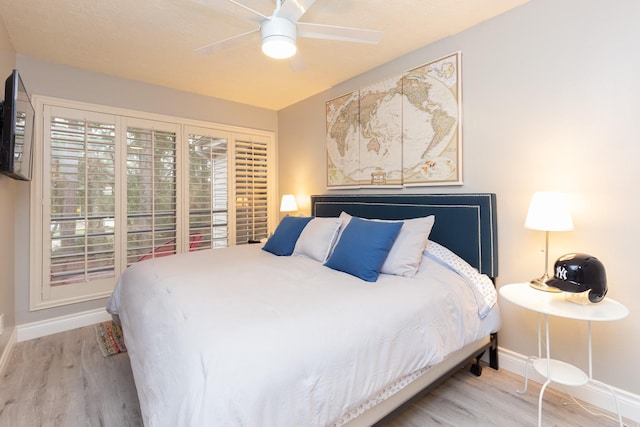 bedroom featuring hardwood / wood-style floors and ceiling fan