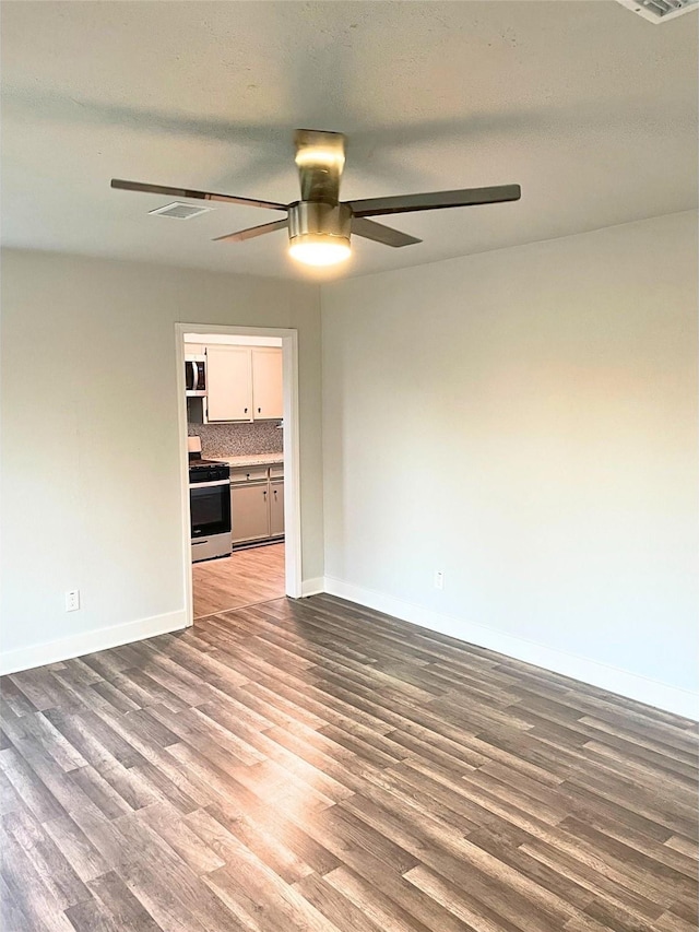 spare room featuring hardwood / wood-style floors