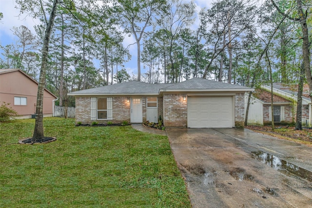 single story home with a front yard and a garage