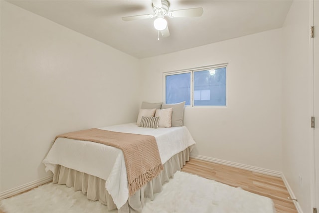 bedroom featuring ceiling fan and hardwood / wood-style flooring