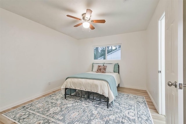 bedroom featuring light hardwood / wood-style flooring and ceiling fan