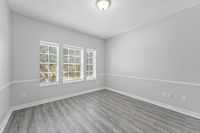 unfurnished room featuring hardwood / wood-style flooring