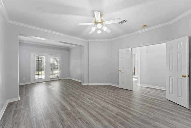 unfurnished room with ceiling fan, light wood-type flooring, and crown molding