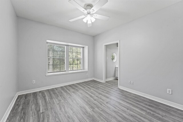 empty room featuring wood-type flooring and ceiling fan