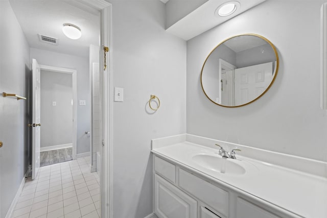 bathroom with vanity and tile patterned floors