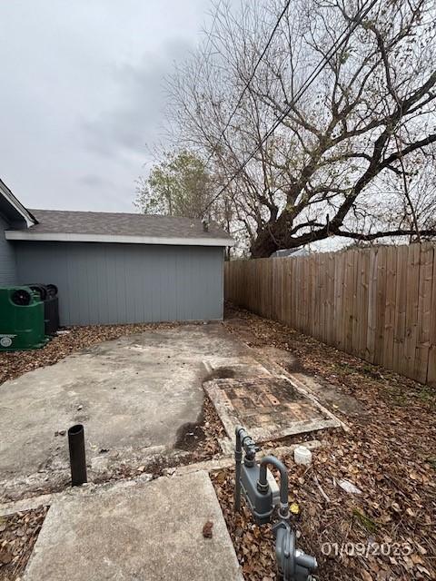 view of yard featuring central AC unit and a patio area