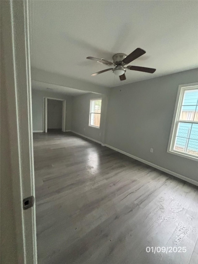 unfurnished room with hardwood / wood-style floors