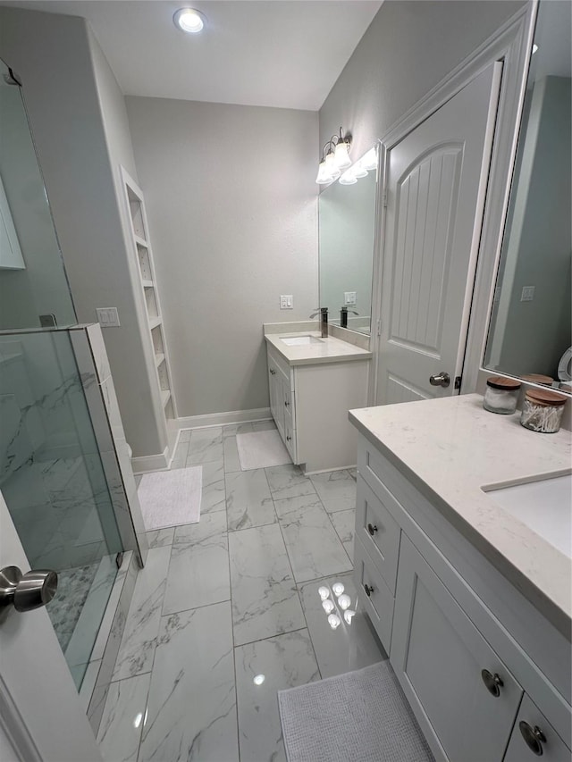 bathroom with vanity and a shower with shower door