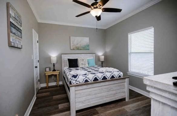 bedroom with ceiling fan, dark hardwood / wood-style floors, and crown molding