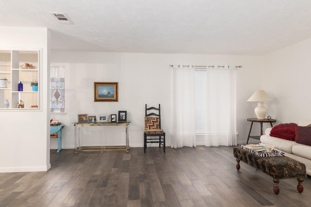 living area with dark wood-type flooring