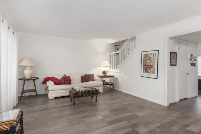 living room featuring dark wood-type flooring