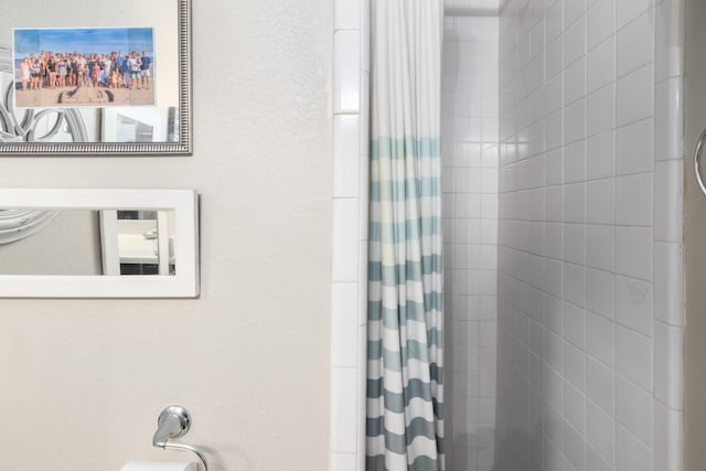 bathroom with a shower with shower curtain