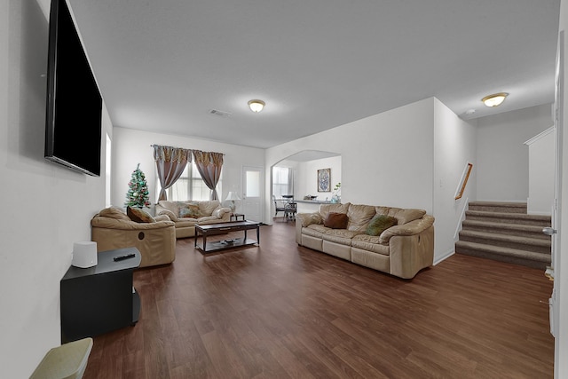 living room with dark hardwood / wood-style floors