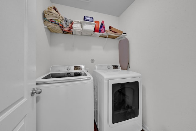 laundry area featuring independent washer and dryer