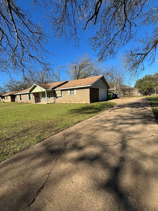 view of home's exterior featuring a yard and a garage