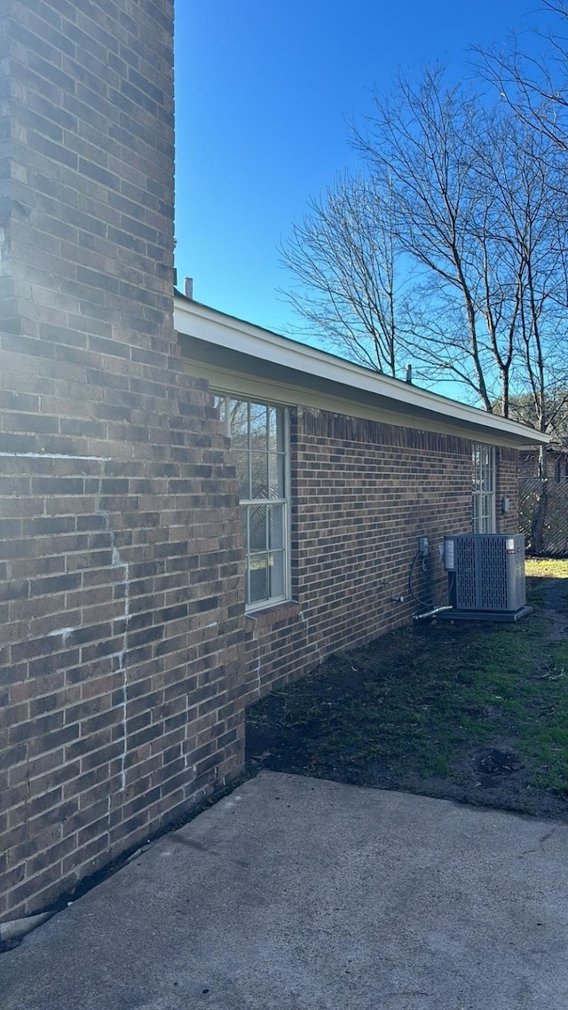 view of property exterior featuring central AC