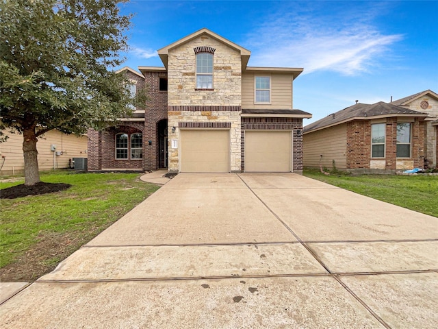 front of property featuring a front lawn, central AC unit, and a garage