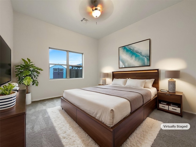 carpeted bedroom featuring ceiling fan