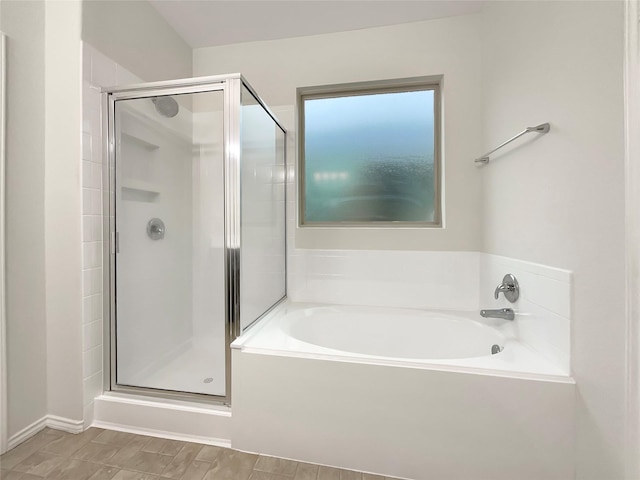 bathroom featuring plus walk in shower