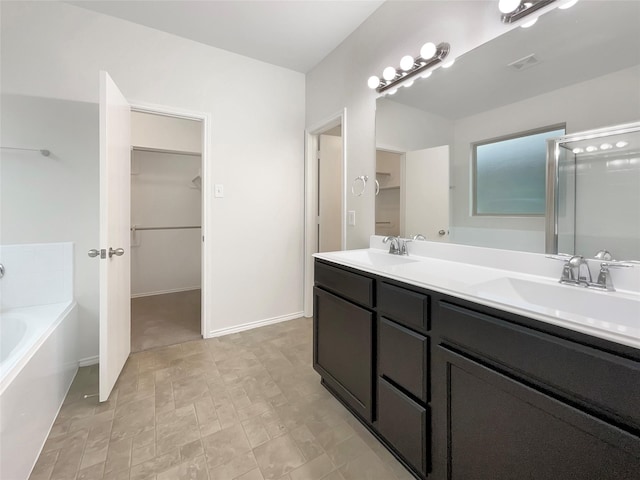 bathroom with plus walk in shower and vanity