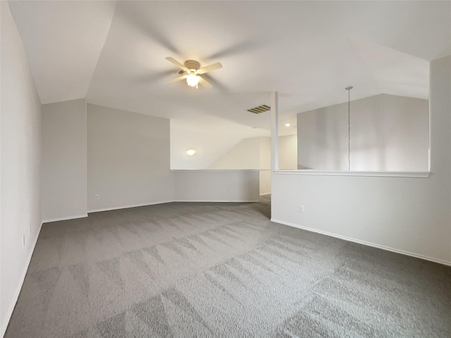 additional living space with carpet floors, ceiling fan, and lofted ceiling