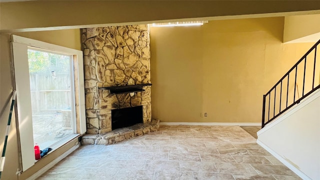 unfurnished living room featuring a fireplace