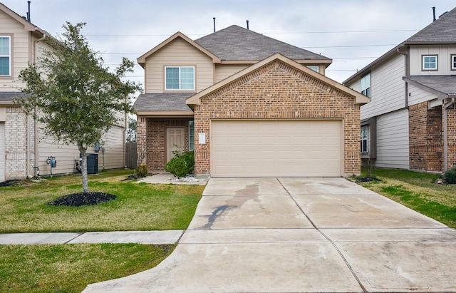 view of front of home with a front yard, central AC unit, and a garage