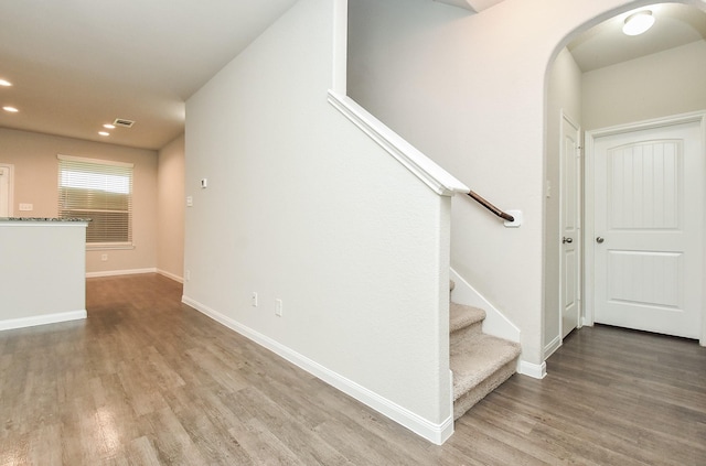 staircase featuring hardwood / wood-style flooring