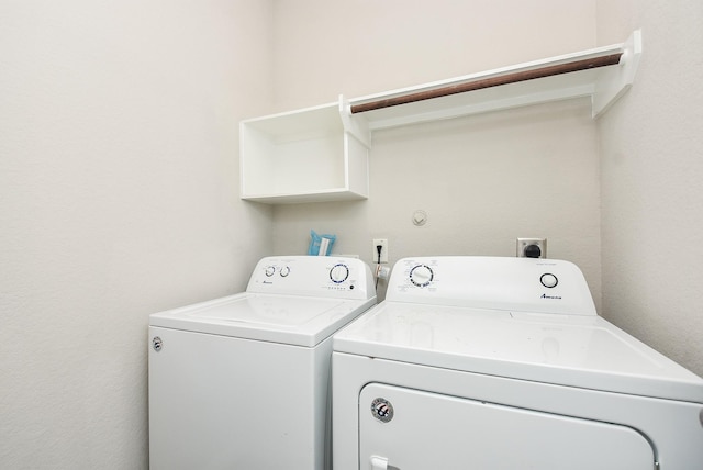 clothes washing area with independent washer and dryer