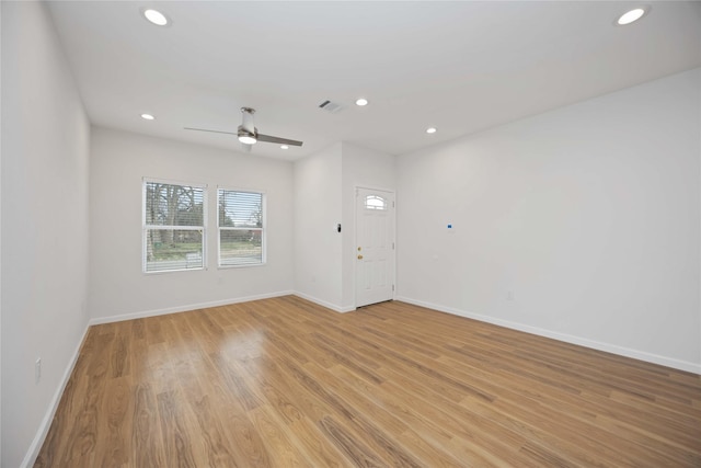 spare room with ceiling fan and light hardwood / wood-style flooring