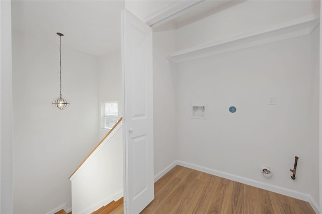 laundry room with washer hookup, light hardwood / wood-style flooring, and gas dryer hookup