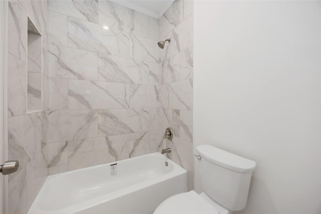 bathroom with tiled shower / bath combo and toilet